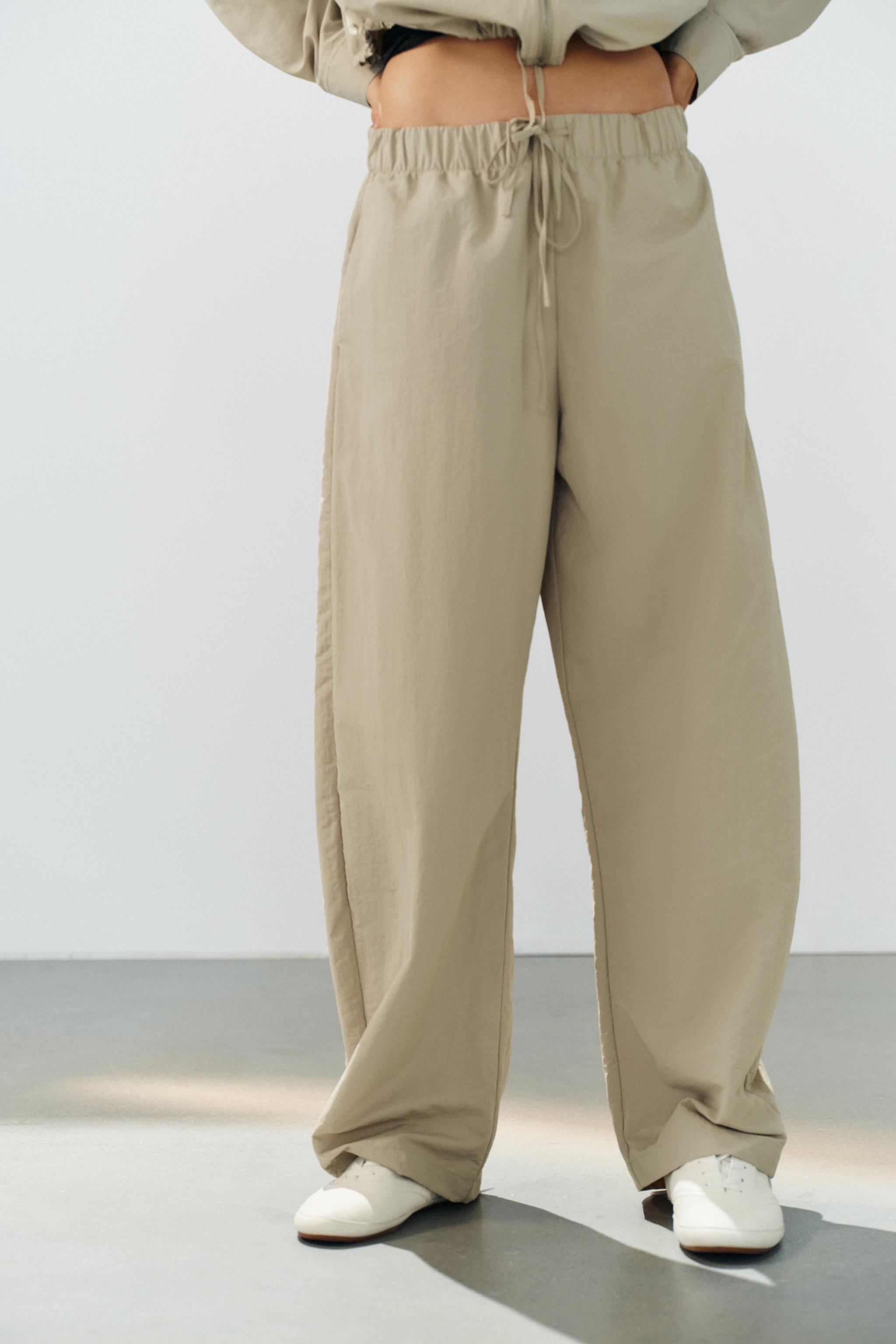 PANTALON EN TISSU TECHNIQUE ÉLASTIQUE